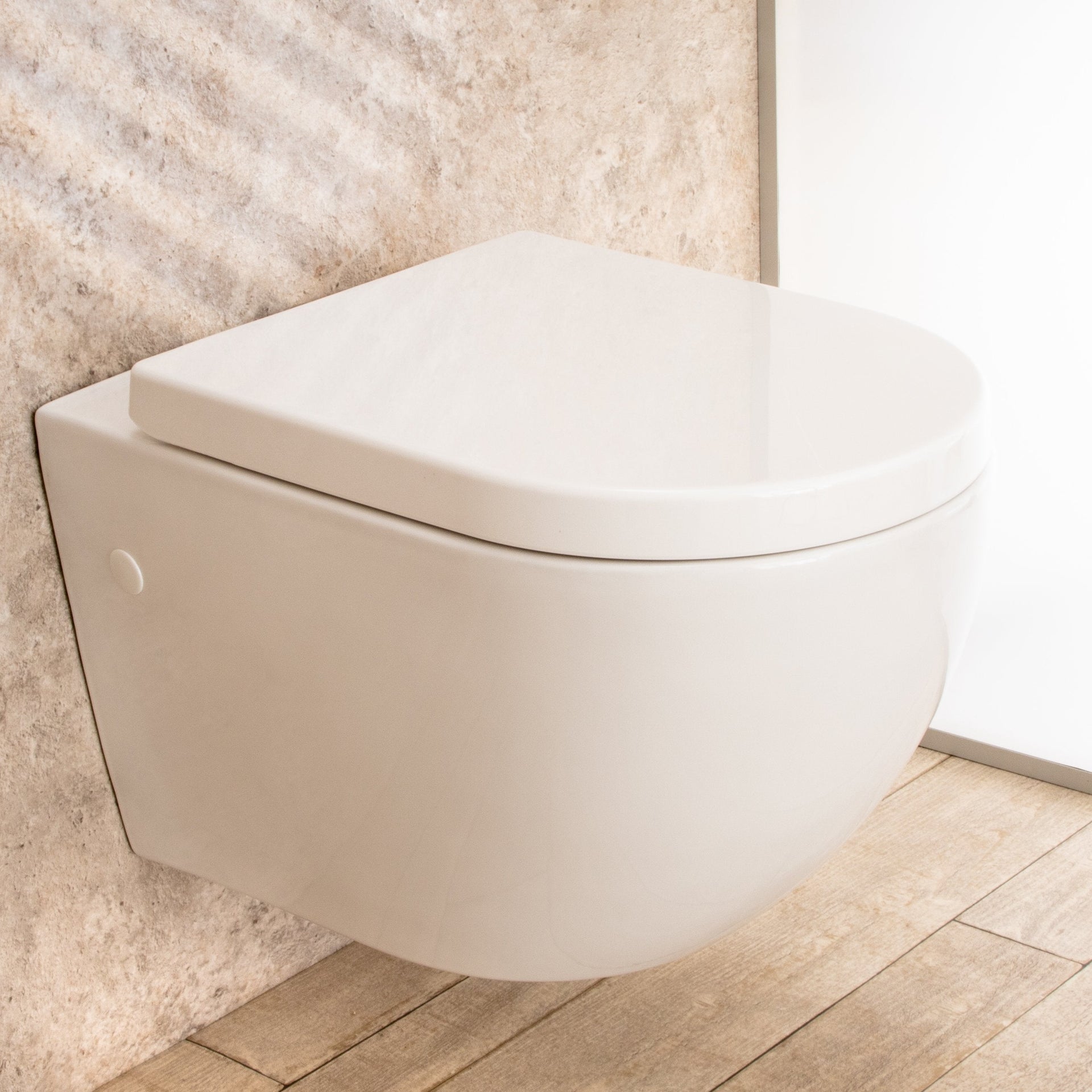 WC Sospeso Vortix in ceramica senza brida con copri vaso L36xP55xA33cm